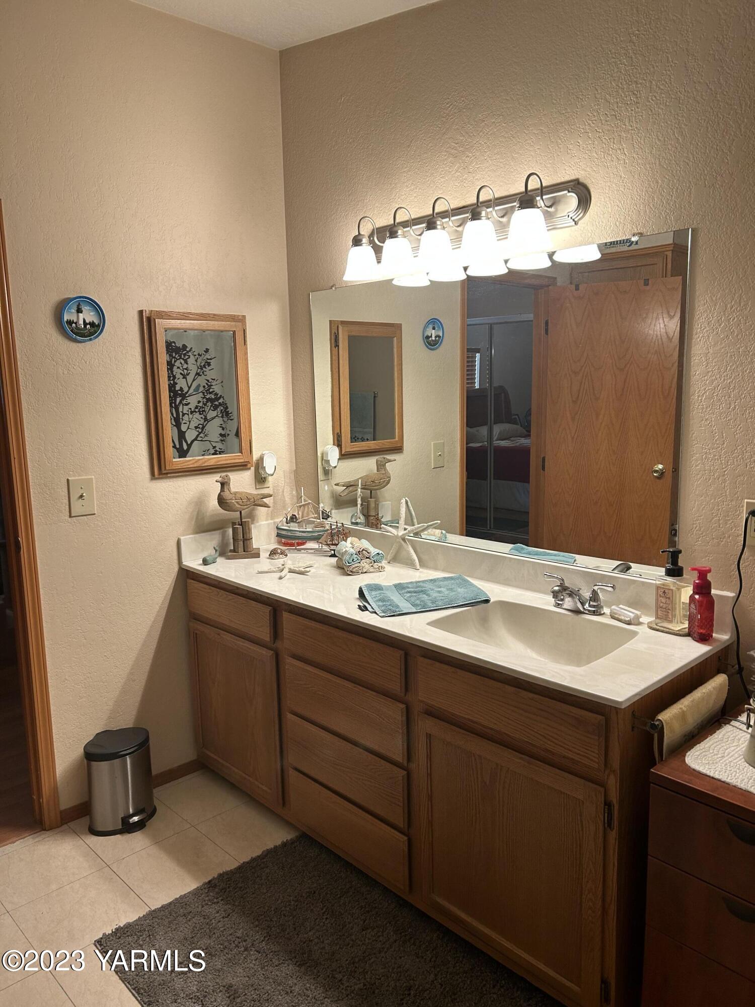 3701 Gun Club Road, Unit 83 Yakima, WA 98901 - Photo 18 of 21 a bathroom with a sink double vanity and a mirror
