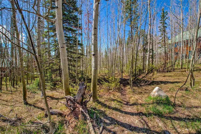 a view of a road with a building in the background