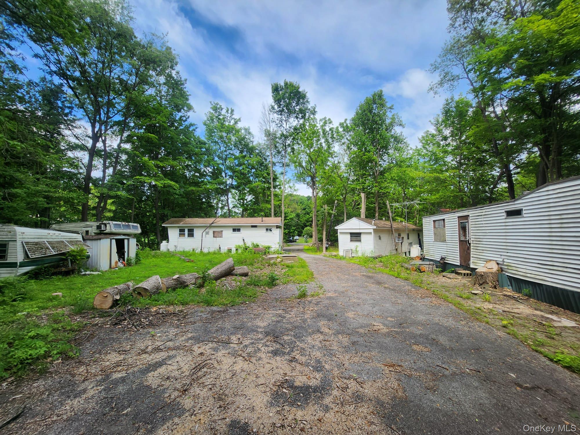 459 Gardnertown Road Newburgh, NY 12550 - Photo 4 of 5 a backyard of a house with a garden and plants