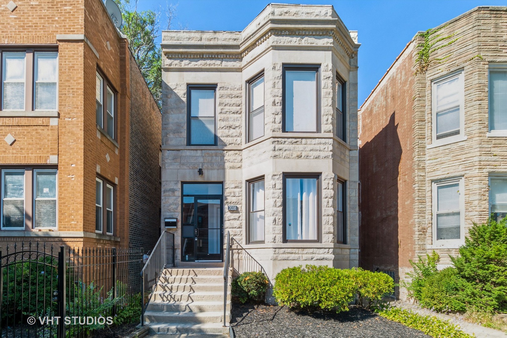 a view of a brick building with many windows
