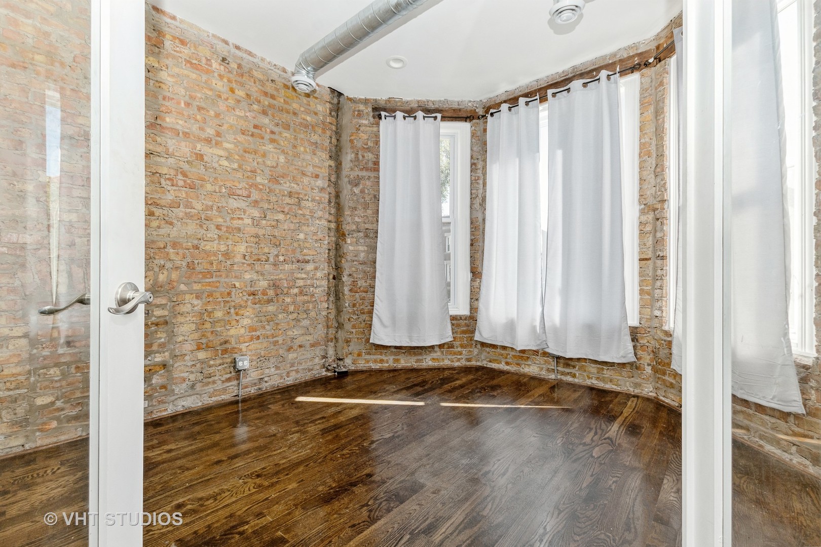 Undisclosed Address Chicago, IL 60637 - Photo 2 of 12 a view of a room with wooden floor and a window