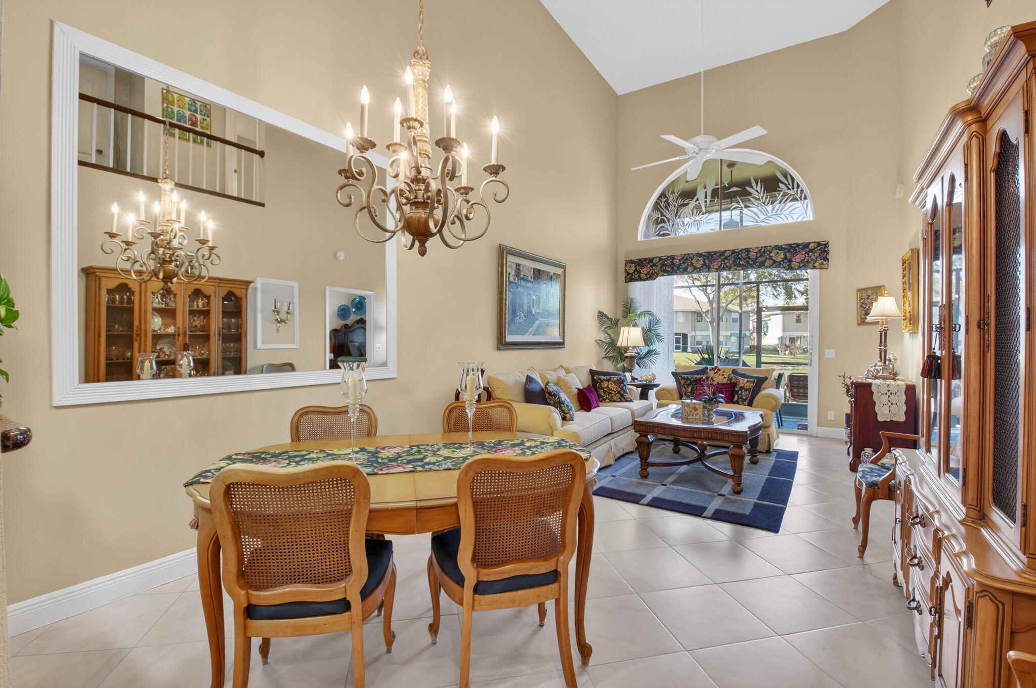 9064 Boca Gardens Parkway, Unit B Boca Raton, FL 33496 - Photo 11 of 41 a view of a dining room with furniture and a chandelier