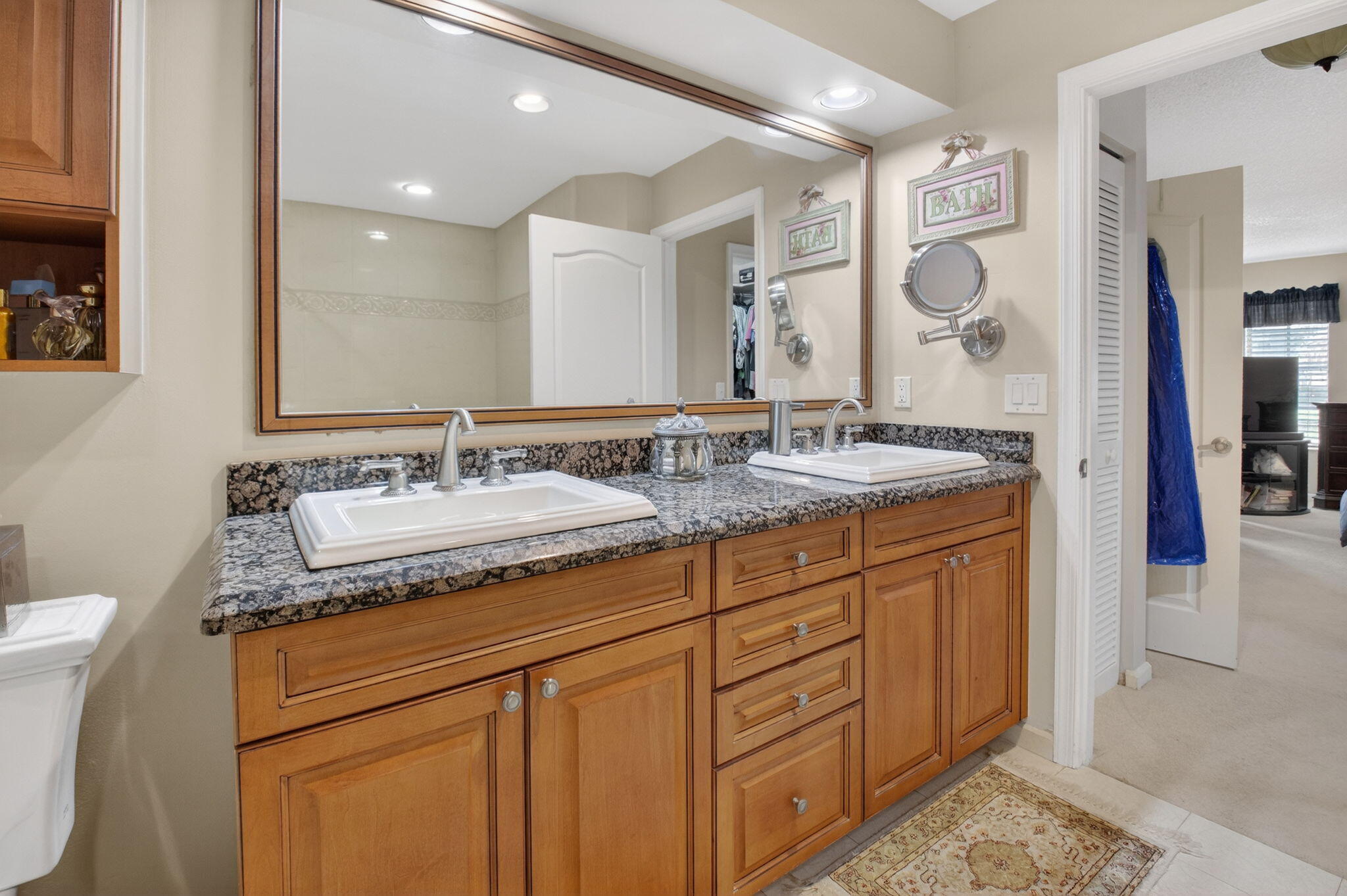 9064 Boca Gardens Parkway, Unit B Boca Raton, FL 33496 - Photo 18 of 41 a bathroom with a granite countertop sink and a mirror