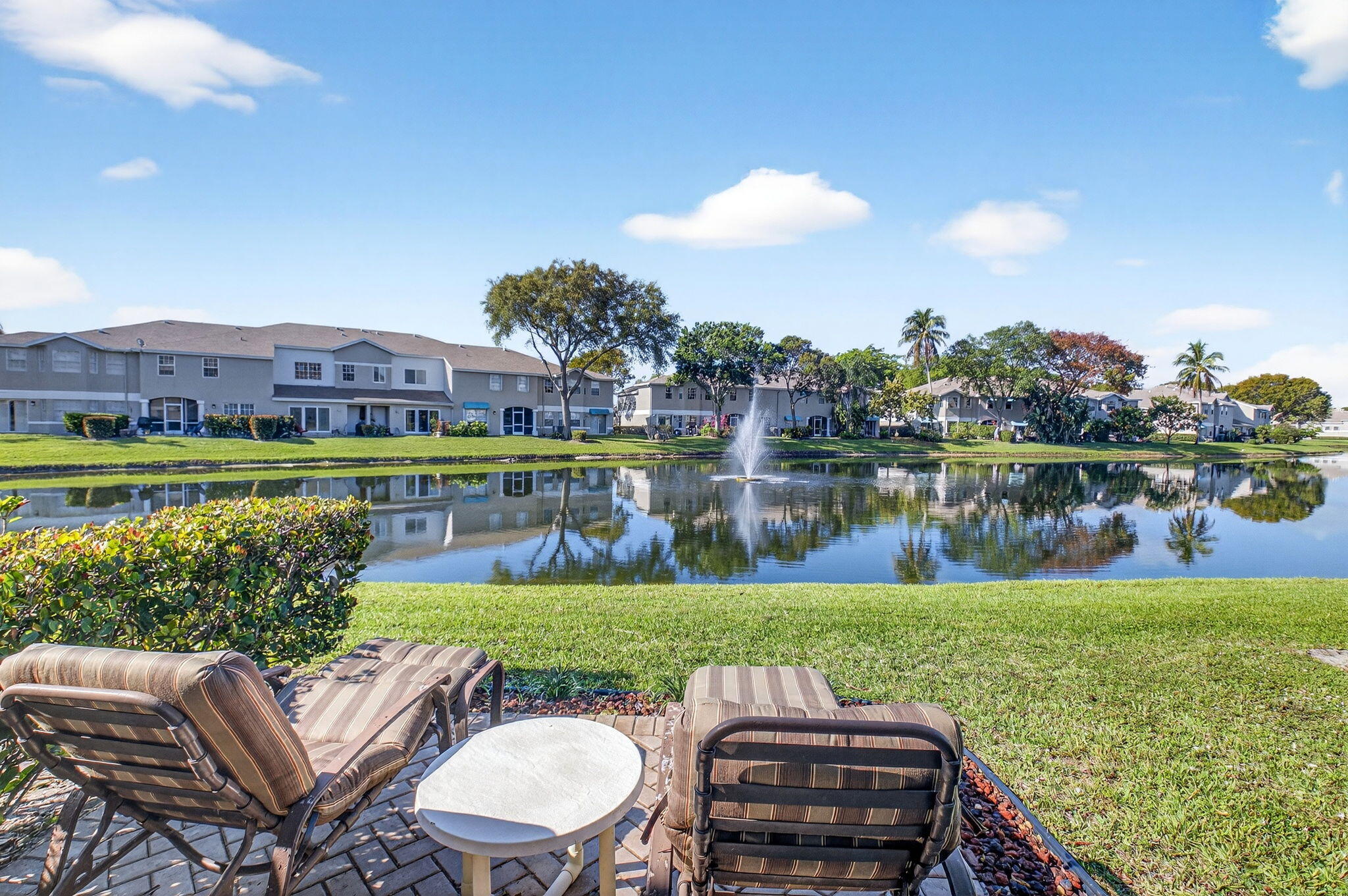 9064 Boca Gardens Parkway, Unit B Boca Raton, FL 33496 - Photo 3 of 41 a view of a lake with a yard swimming pool and outdoor seating