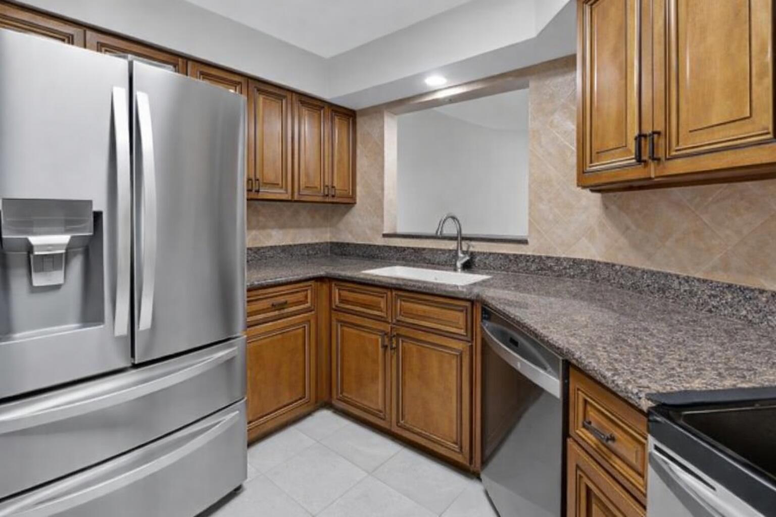 9064 Boca Gardens Parkway, Unit B Boca Raton, FL 33496 - Photo 6 of 41 Modern kitchen with stainless appliances