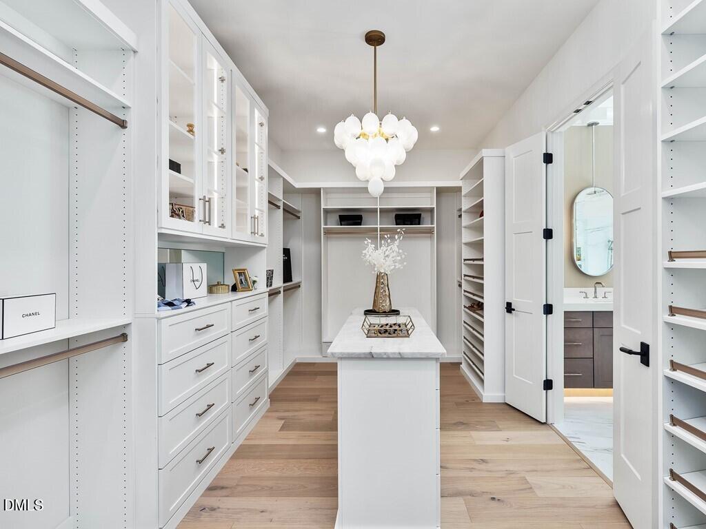 7013 Buckhead Drive Raleigh, NC 27615 - Photo 29 of 80 a kitchen with stainless steel appliances a stove refrigerator and cabinets