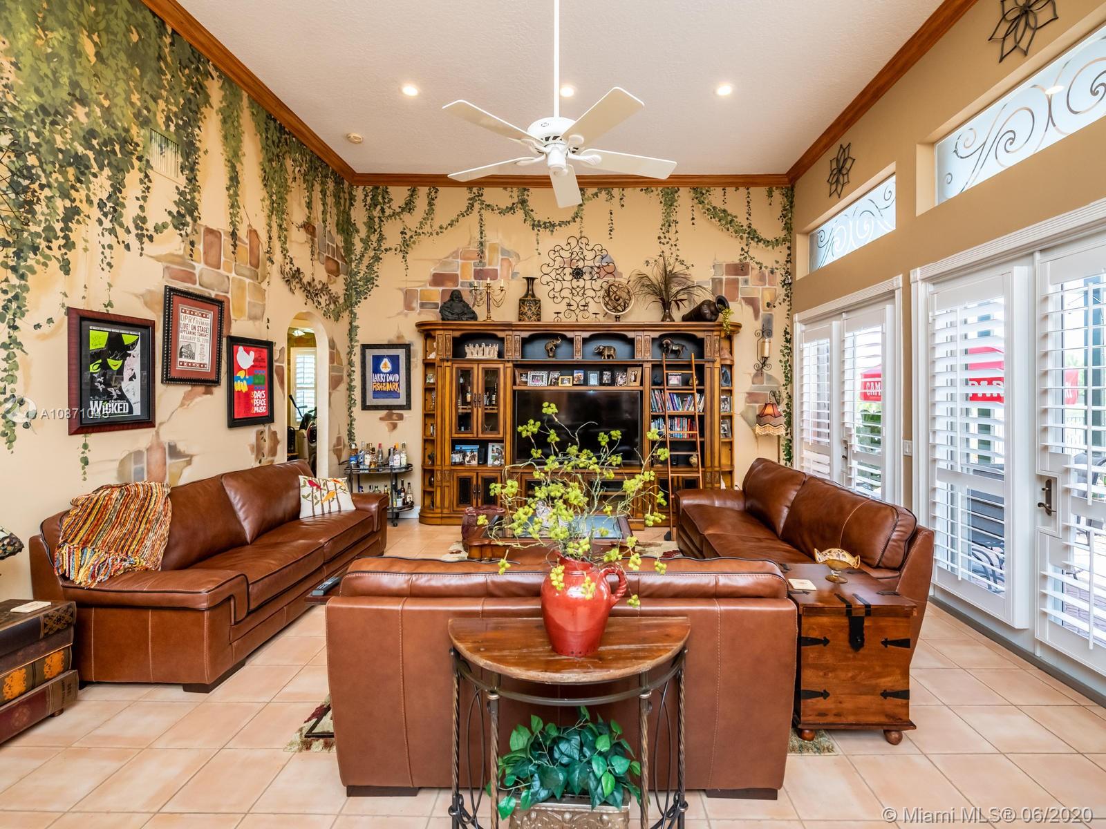 21663 Fall River Drive Boca Raton, FL 33428 - Photo 14 of 48 a living room with patio furniture and a chandelier