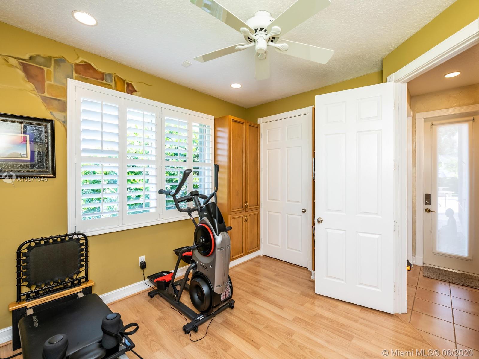 21663 Fall River Drive Boca Raton, FL 33428 - Photo 23 of 48 a view of a room with gym equipment