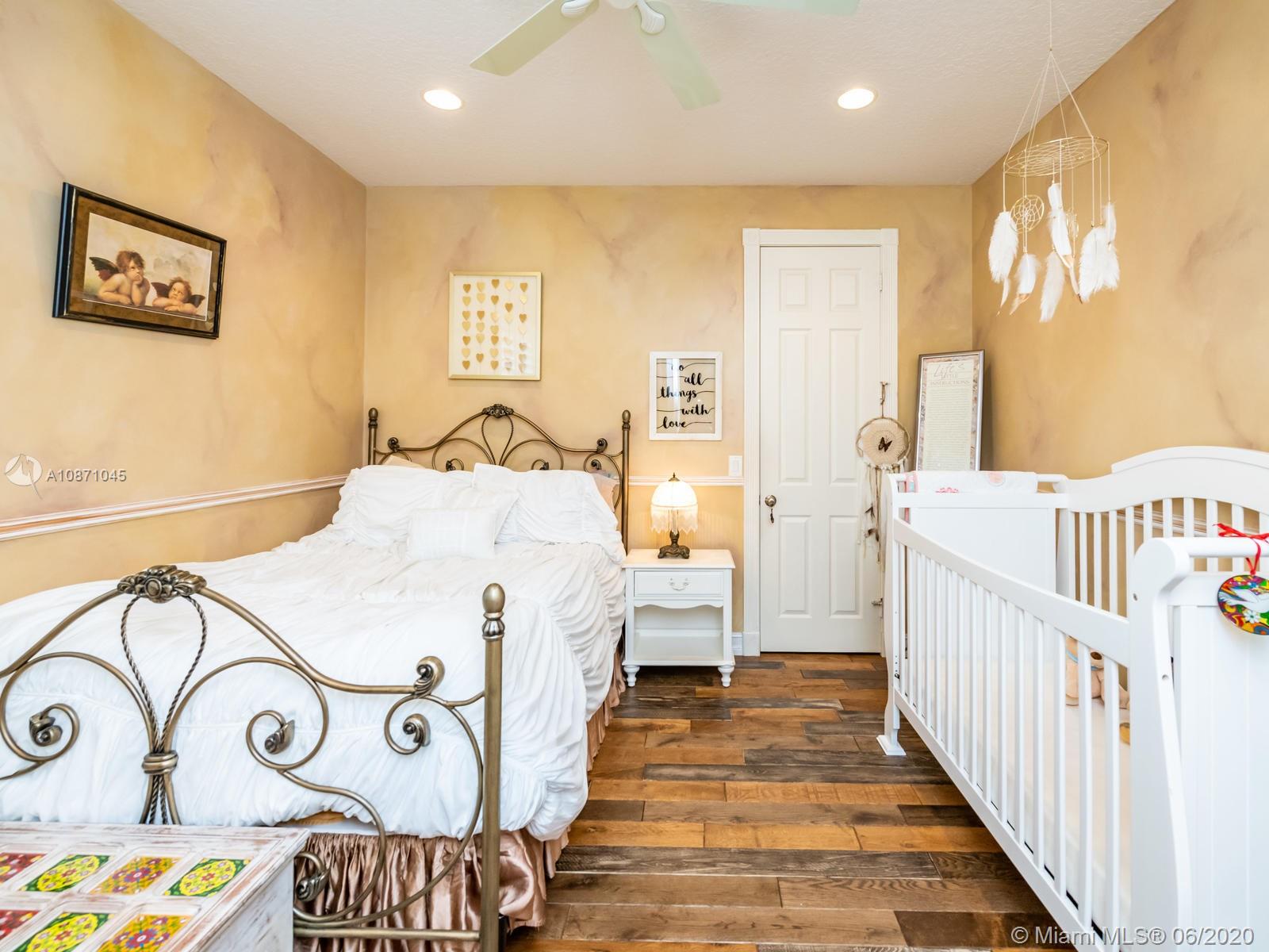 21663 Fall River Drive Boca Raton, FL 33428 - Photo 25 of 48 a view of a bedroom with furniture and staircase