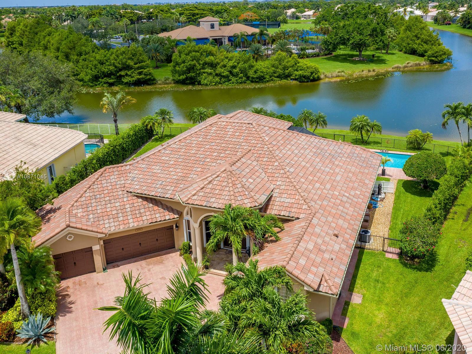 21663 Fall River Drive Boca Raton, FL 33428 - Photo 3 of 48 an aerial view of a house with outdoor space and lake view