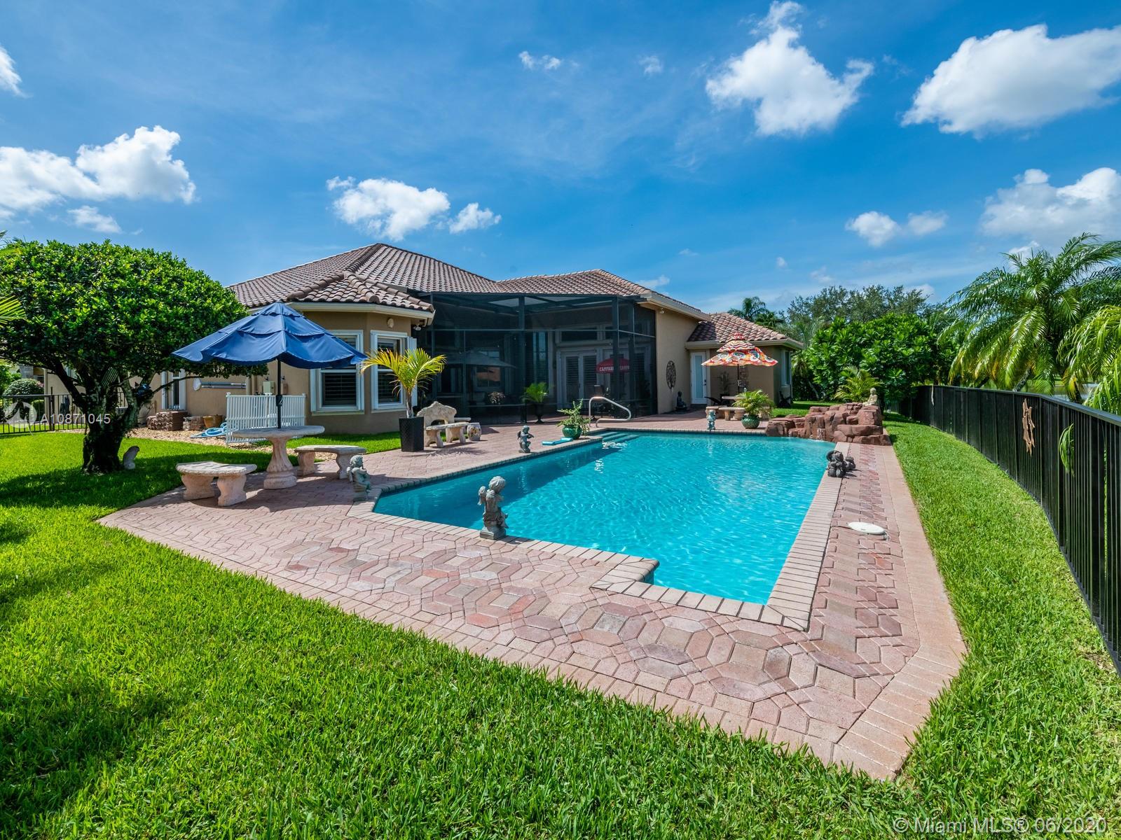 21663 Fall River Drive Boca Raton, FL 33428 - Photo 35 of 48 a view of a house with swimming pool and a yard