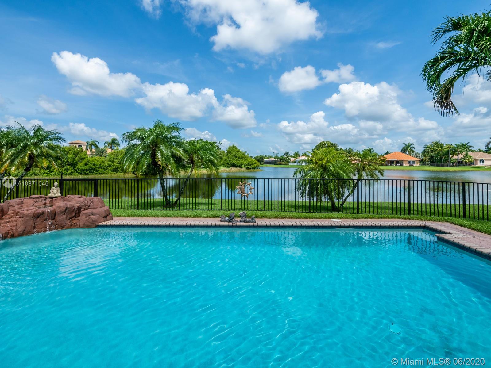 21663 Fall River Drive Boca Raton, FL 33428 - Photo 36 of 48 a view of a garden and basketball court