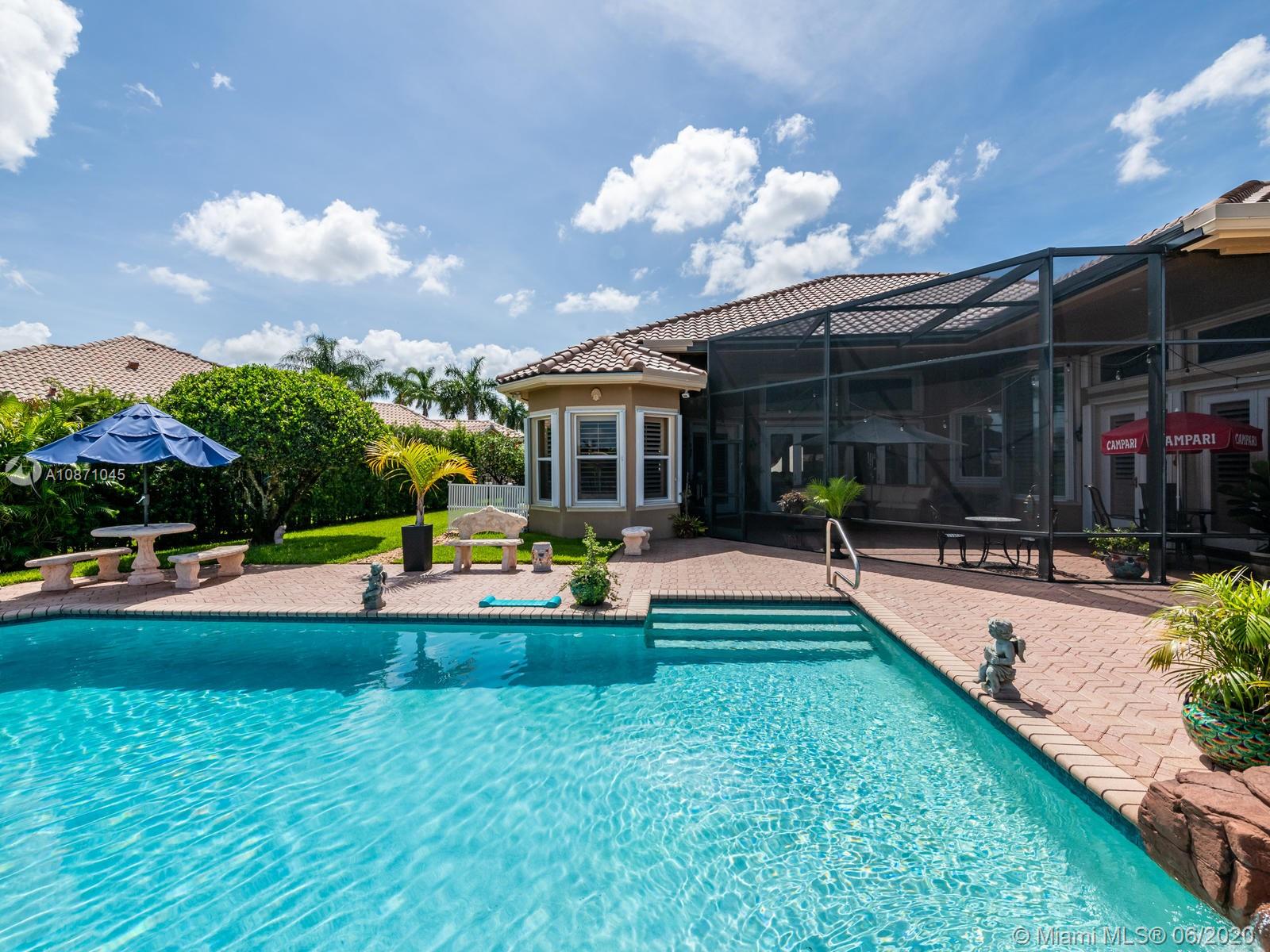 21663 Fall River Drive Boca Raton, FL 33428 - Photo 39 of 48 a view of a house with swimming pool and sitting area