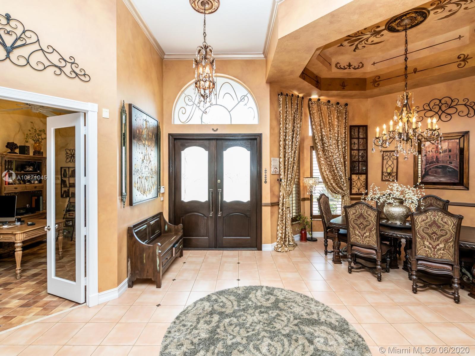 21663 Fall River Drive Boca Raton, FL 33428 - Photo 6 of 48 a living room with furniture chandelier and a window