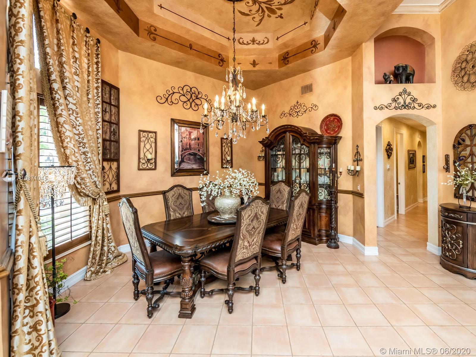 21663 Fall River Drive Boca Raton, FL 33428 - Photo 7 of 48 a view of a dining room with furniture