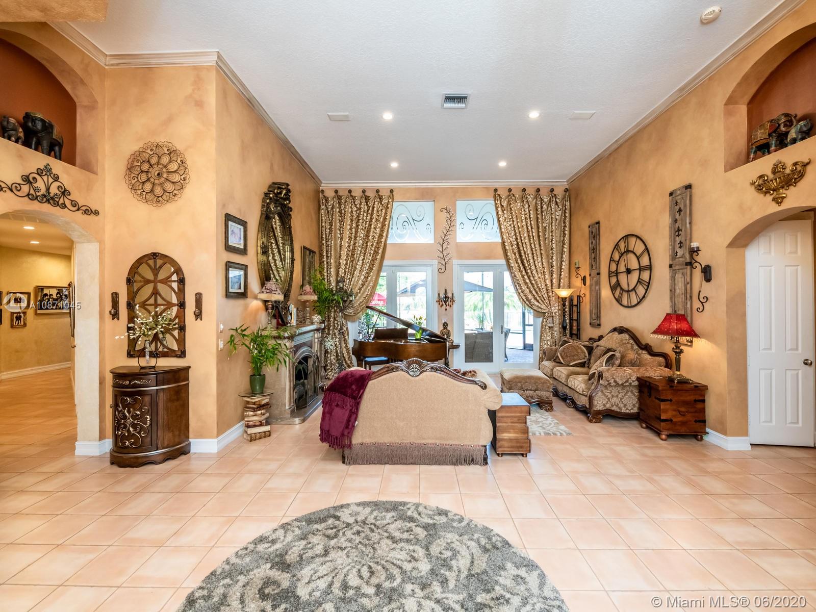 21663 Fall River Drive Boca Raton, FL 33428 - Photo 8 of 48 a bedroom with furniture and a large window