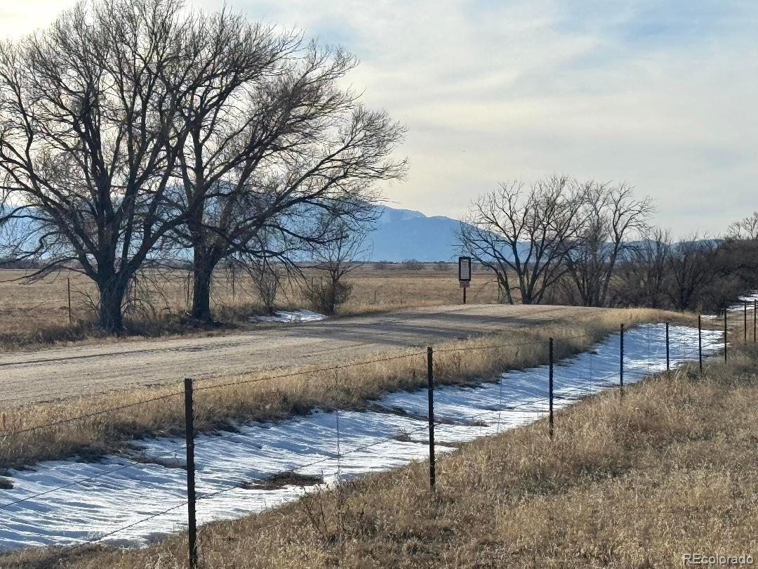 9540 North Log Road Calhan, CO 80808 - Photo 10 of 11 a backyard of a house with table and chairs