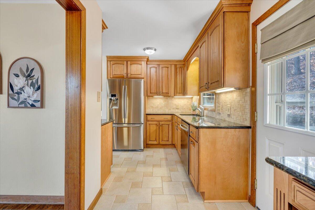 4151 Givens Road Salem, VA 24153 - Photo 14 of 45 a kitchen with stainless steel appliances granite countertop a refrigerator and a stove top oven