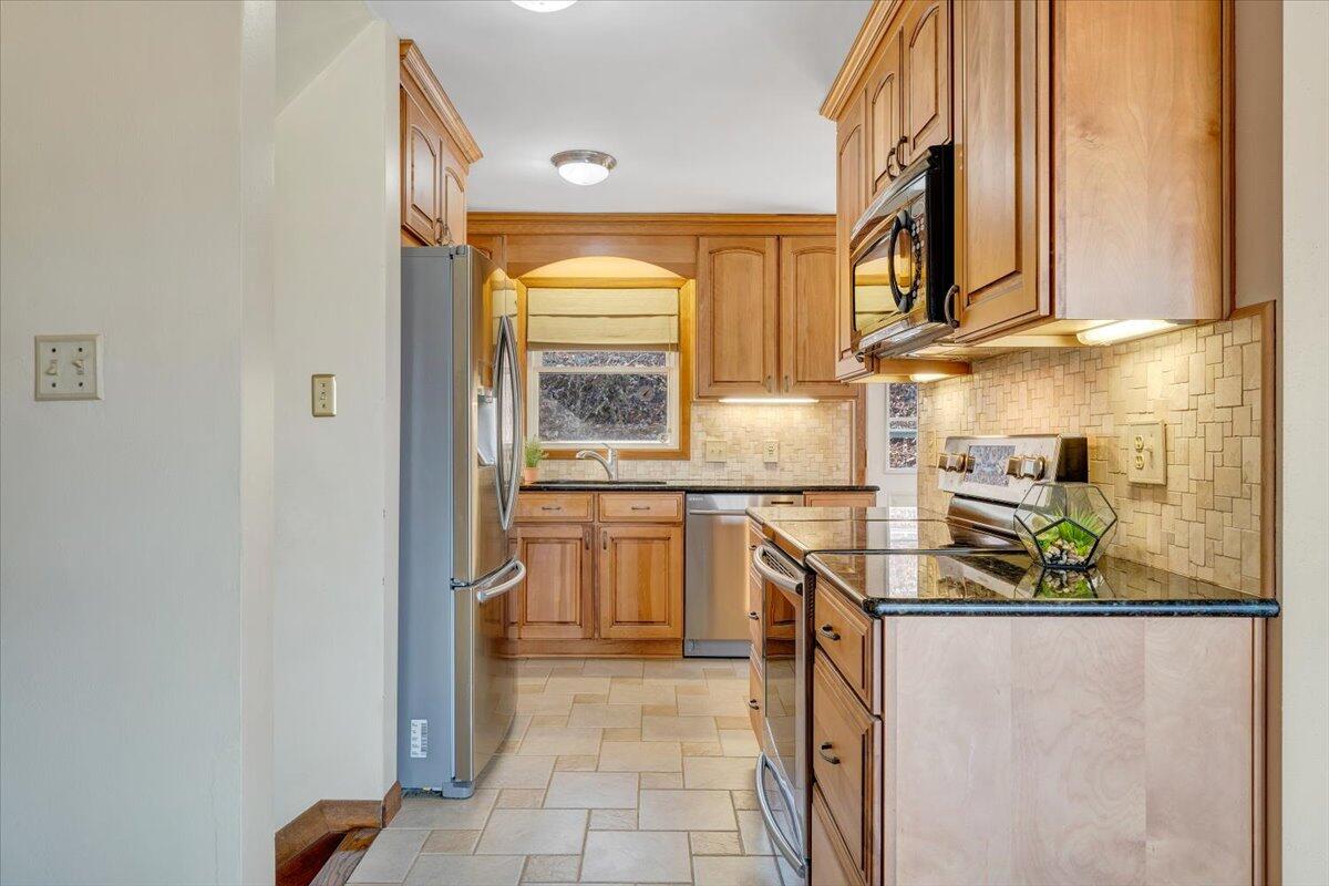 4151 Givens Road Salem, VA 24153 - Photo 20 of 45 a kitchen filled with stainless steel appliances granite countertop a refrigerator and a sink