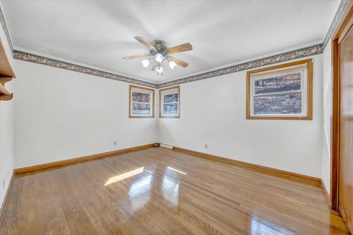 4151 Givens Road Salem, VA 24153 - Photo 21 of 45 a view of an empty room with wooden floor and a window