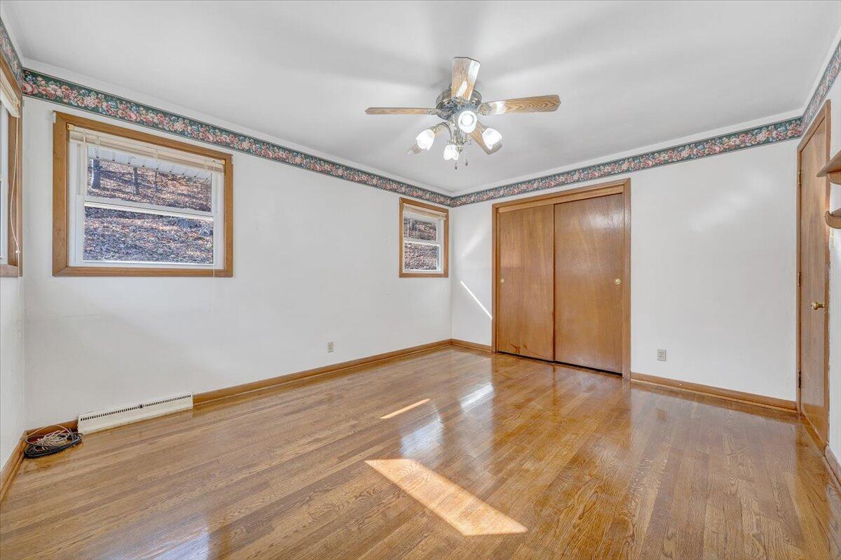 4151 Givens Road Salem, VA 24153 - Photo 22 of 45 a view of an empty room with wooden floor and a window