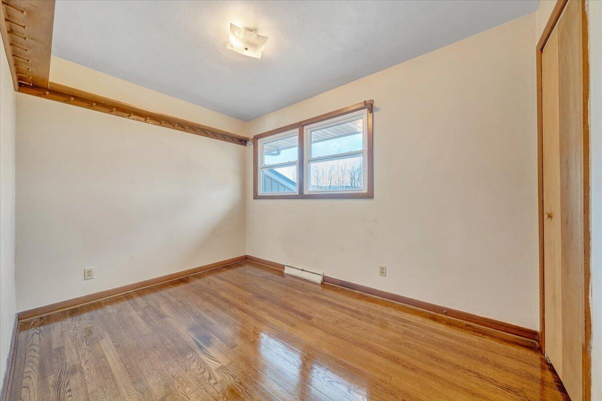 4151 Givens Road Salem, VA 24153 - Photo 23 of 45 a view of an empty room with wooden floor and a window
