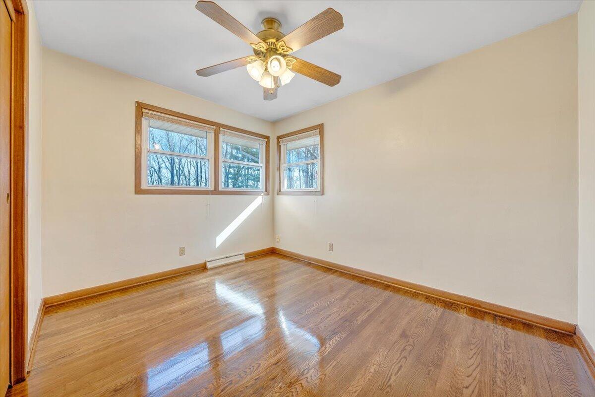 4151 Givens Road Salem, VA 24153 - Photo 24 of 45 an empty room with wooden floor and windows
