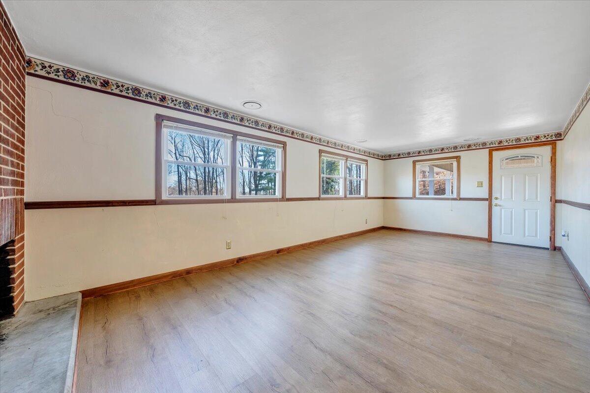 4151 Givens Road Salem, VA 24153 - Photo 26 of 45 an empty room with wooden floor and windows