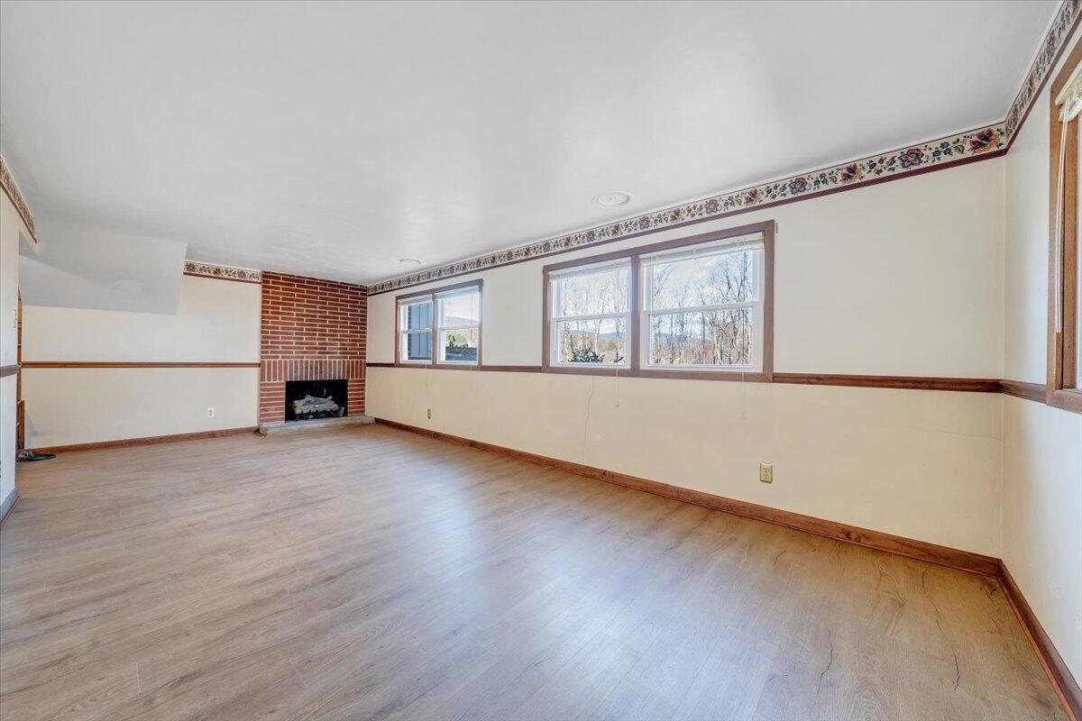 4151 Givens Road Salem, VA 24153 - Photo 27 of 45 a view of empty room with wooden floor and fan