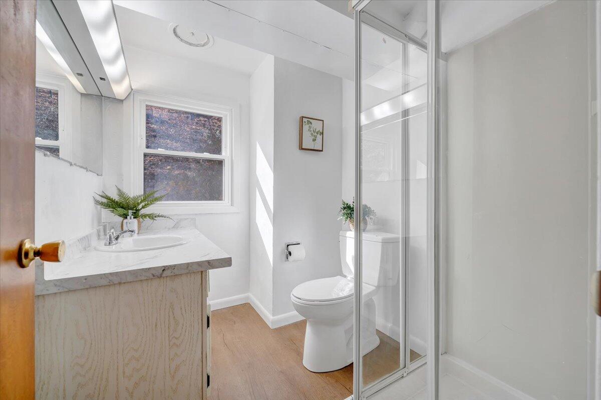 4151 Givens Road Salem, VA 24153 - Photo 31 of 45 a bathroom with a granite countertop sink a toilet and a mirror