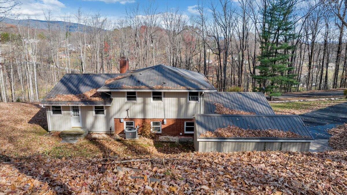 4151 Givens Road Salem, VA 24153 - Photo 39 of 45 a house with tall trees in the background