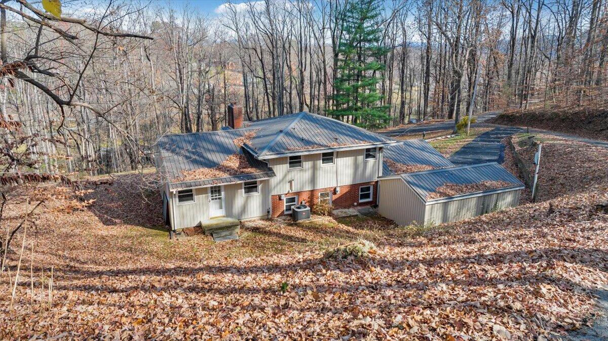 4151 Givens Road Salem, VA 24153 - Photo 40 of 45 a view of a house with a yard and sitting area