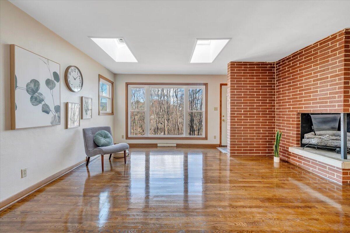 4151 Givens Road Salem, VA 24153 - Photo 10 of 45 a view of an empty room with wooden floor and a window