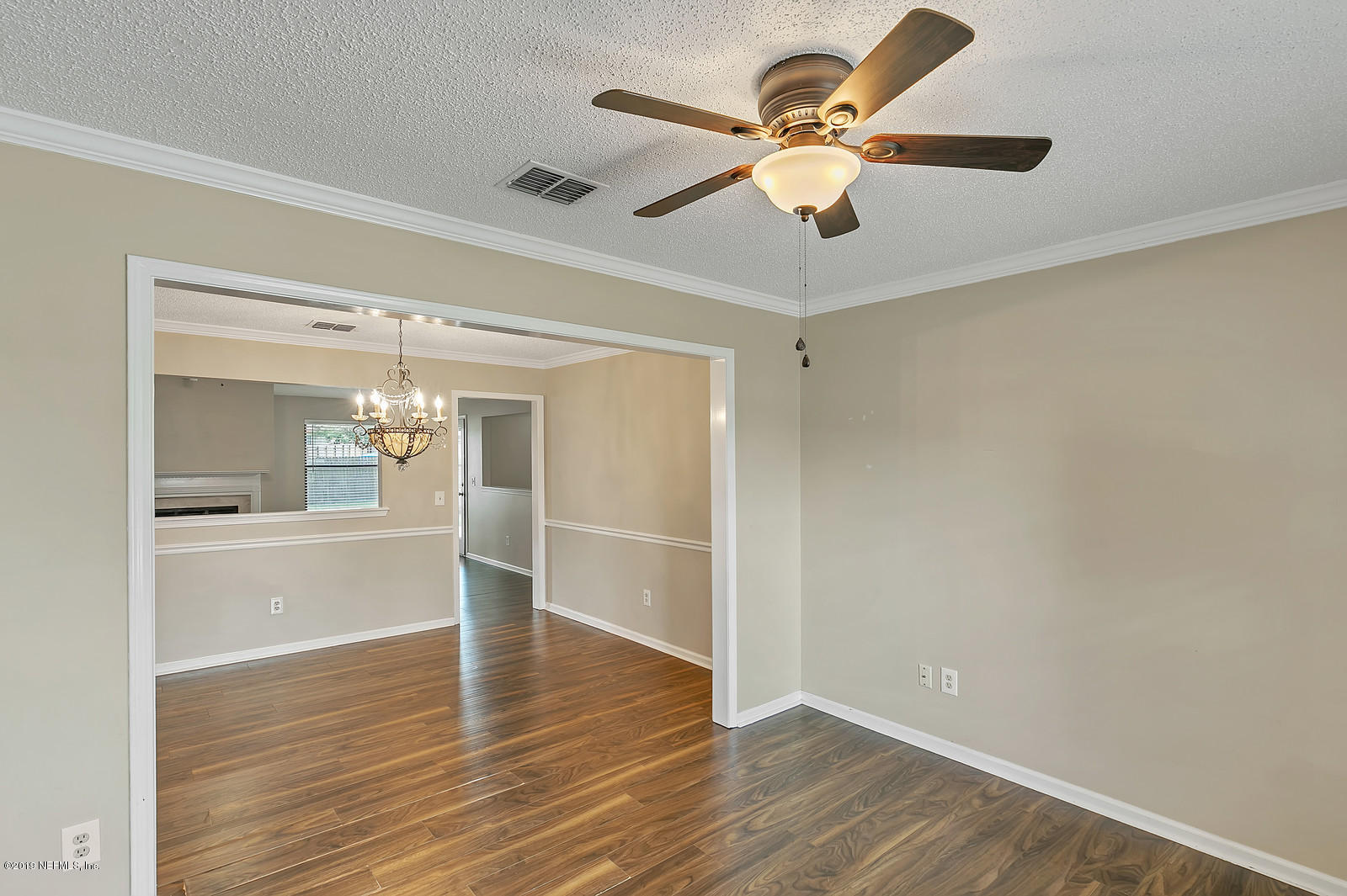 12436 Running River Road South Jacksonville, FL 32225 - Photo 13 of 25 wooden floor in an empty room with a window