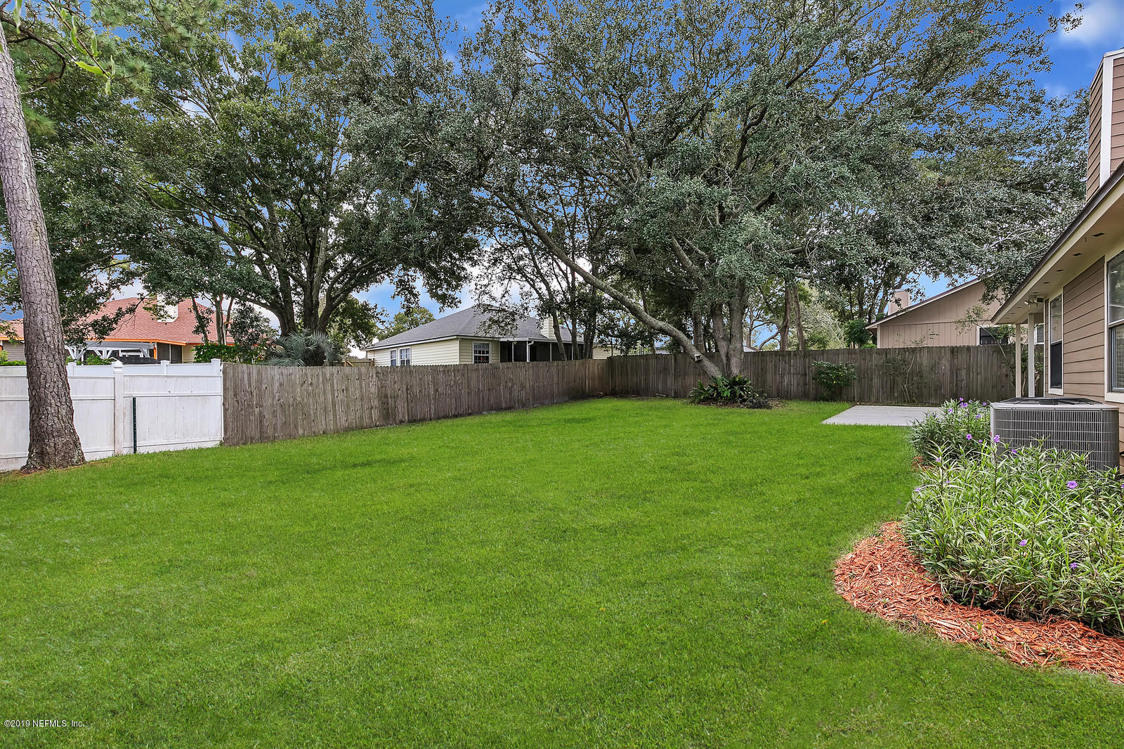 12436 Running River Road South Jacksonville, FL 32225 - Photo 25 of 25 a view of a house with a backyard