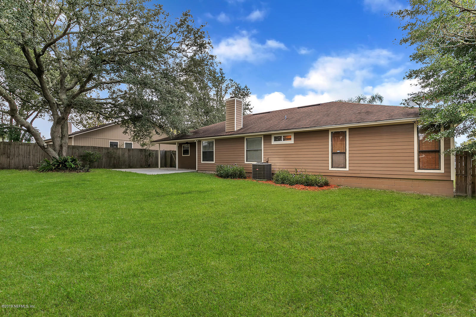 12436 Running River Road South Jacksonville, FL 32225 - Photo 3 of 25 a front view of house with yard and green space