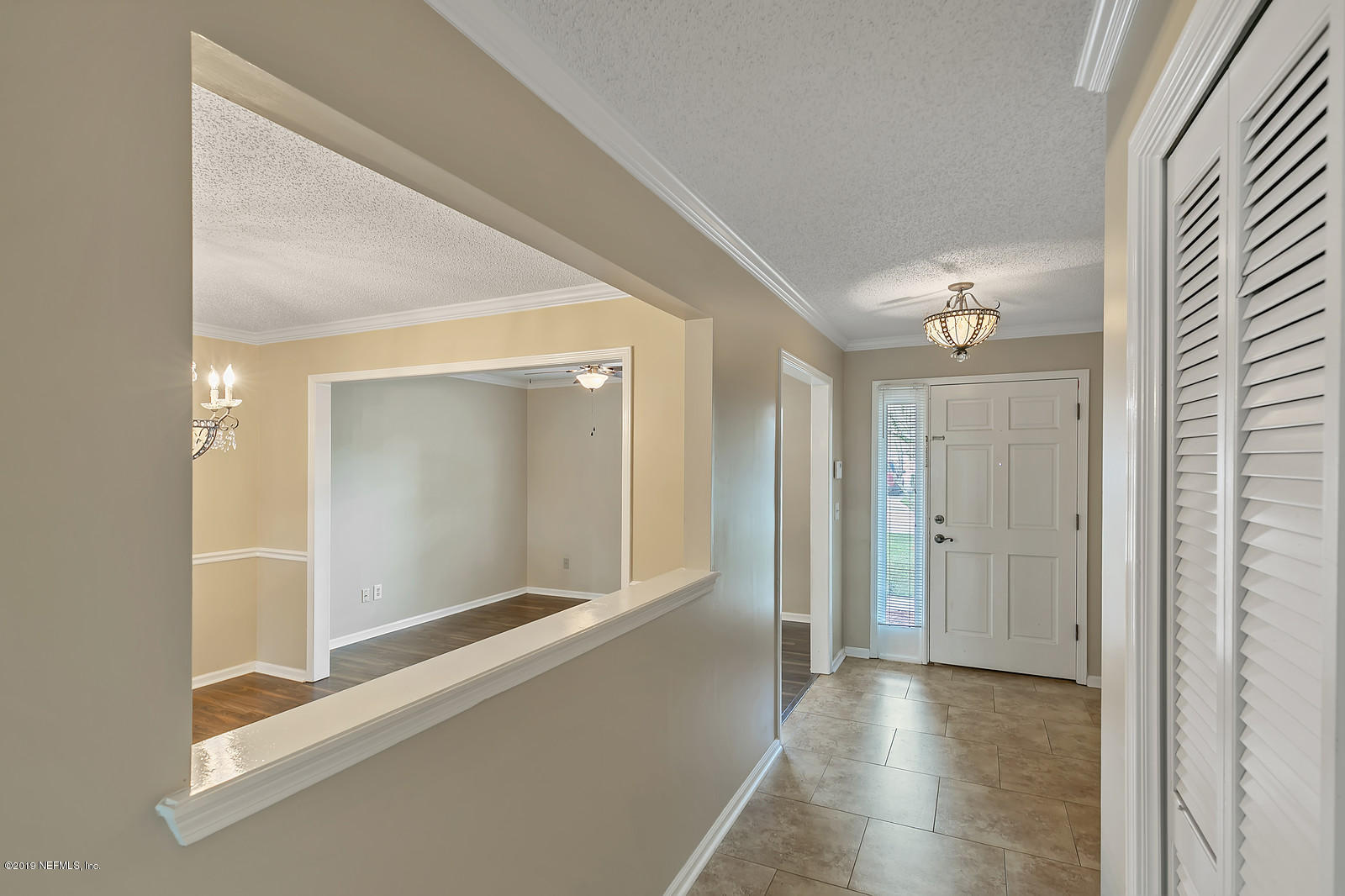12436 Running River Road South Jacksonville, FL 32225 - Photo 8 of 25 a view of a hallway with wooden floor