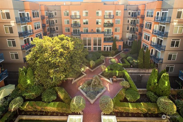 a view of a building with sitting area