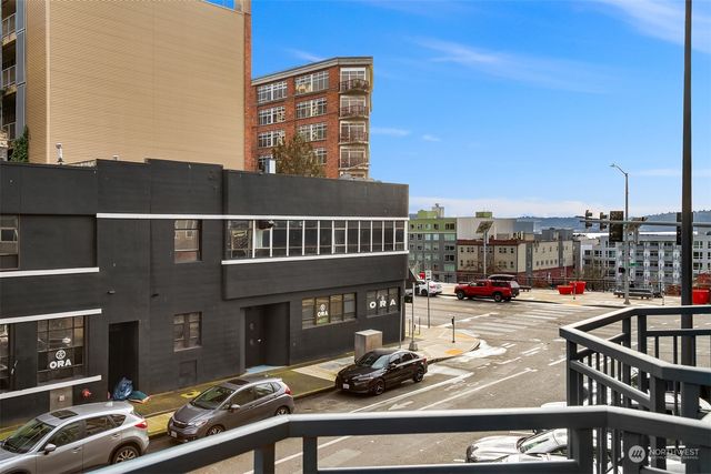 a bed room with a bed mirror and a window