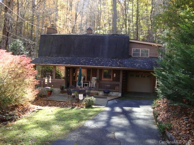 249 Nottingham Road, Unit 10 Maggie Valley, NC 28751 - Photo 1 of 24 a front view of a house with yard and sitting area