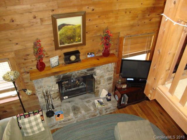 249 Nottingham Road, Unit 10 Maggie Valley, NC 28751 - Photo 13 of 24 a living room with furniture and a fireplace