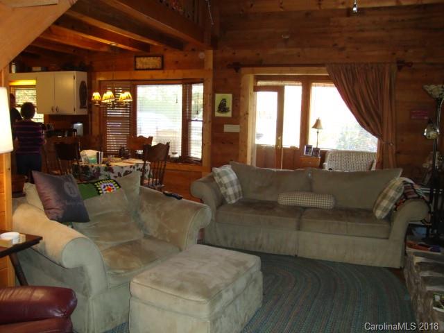 249 Nottingham Road, Unit 10 Maggie Valley, NC 28751 - Photo 10 of 24 a living room with furniture and large windows