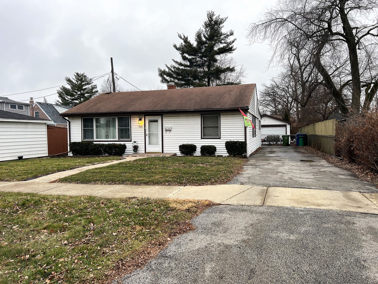 5211 West 92nd Street Oak Lawn, IL 60453 - Photo 1 of 27 a view of a white house with a yard and large tree