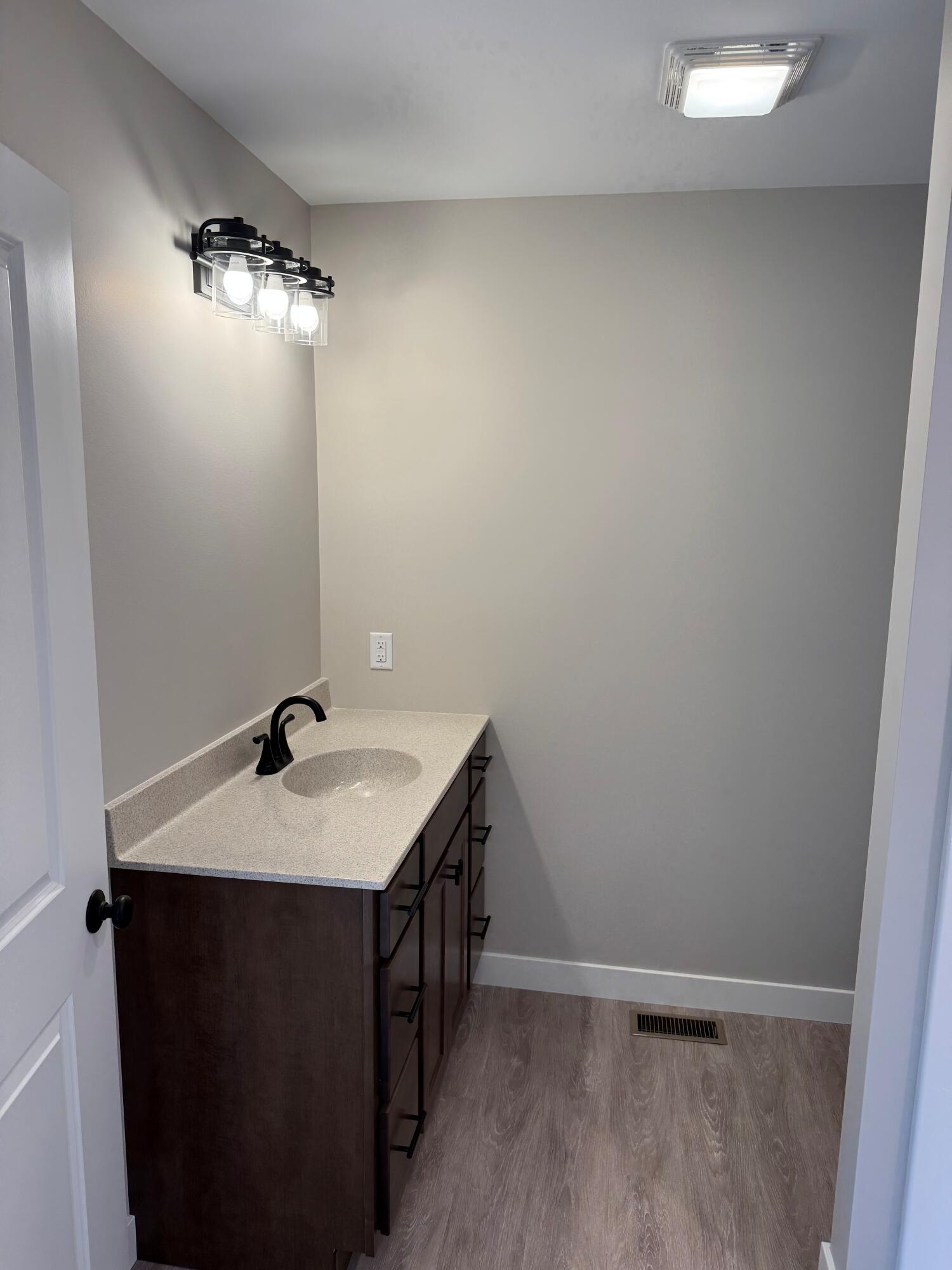 821 9th Street Southwest, Unit 10B De Motte, IN 46310 - Photo 11 of 17 a bathroom with a sink and a mirror