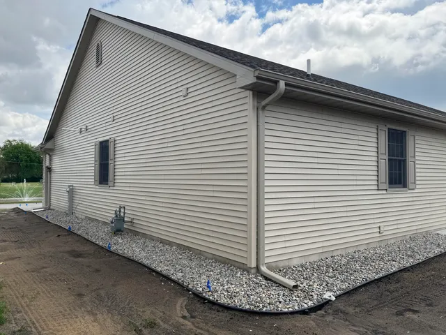a view of a house with a yard and garage