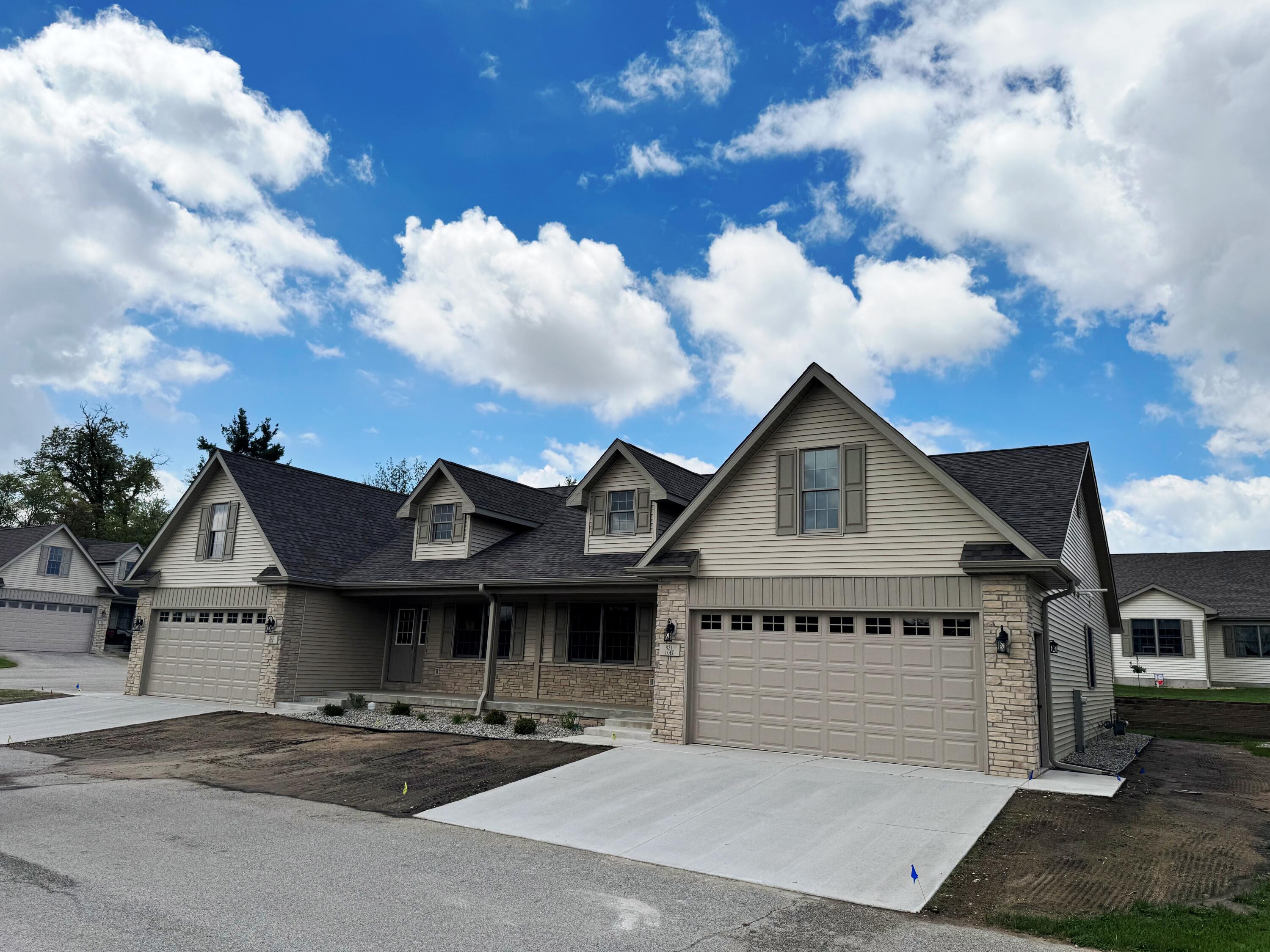 821 9th Street Southwest, Unit 10B De Motte, IN 46310 - Photo 2 of 17 a front view of a house with a yard