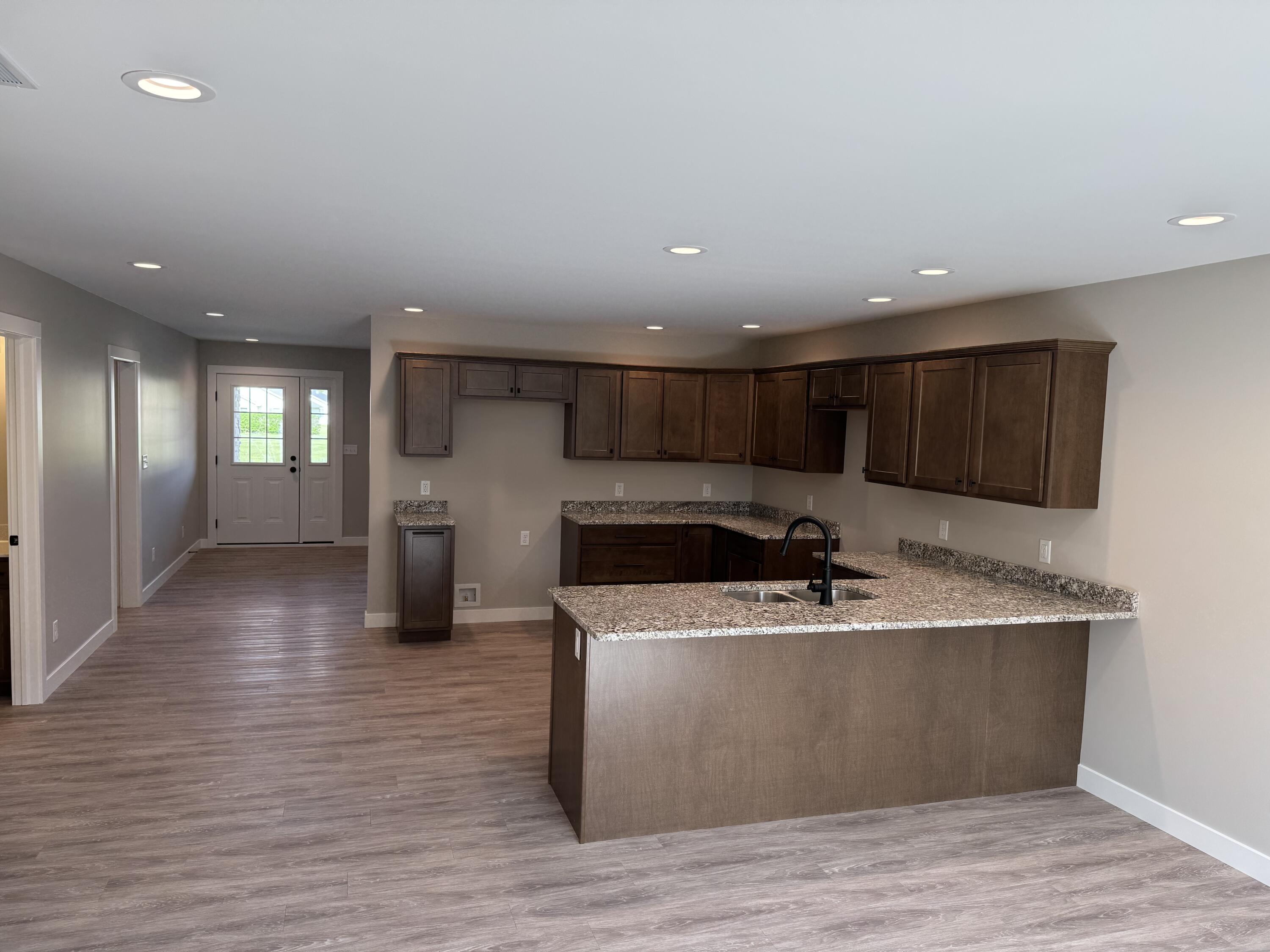 821 9th Street Southwest, Unit 10B De Motte, IN 46310 - Photo 6 of 17 a view of kitchen with stainless steel appliances granite countertop a sink and a stove