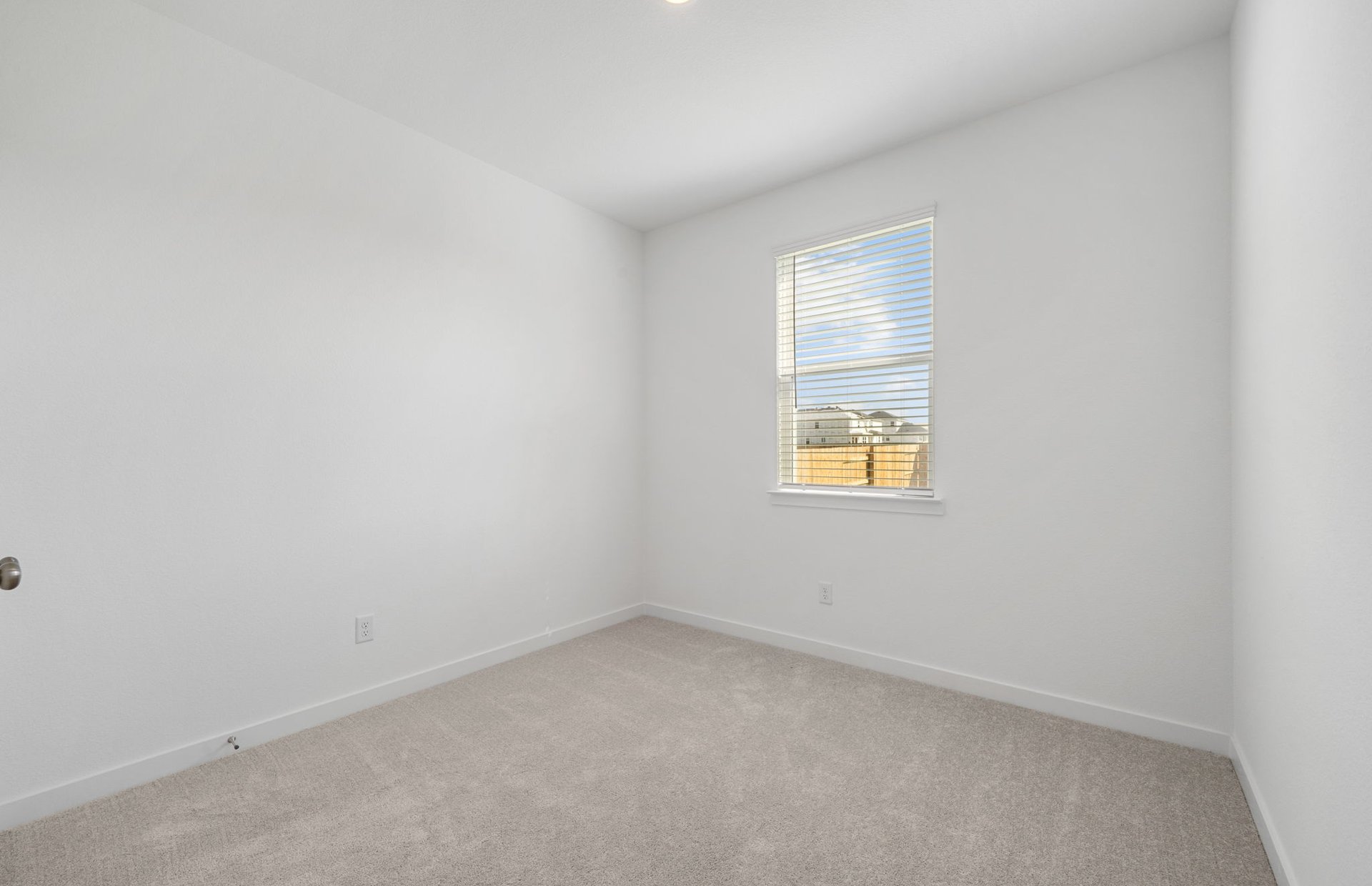 608 Rubber Tree Way Buda, TX 78610 - Photo 26 of 29 an empty room with a window