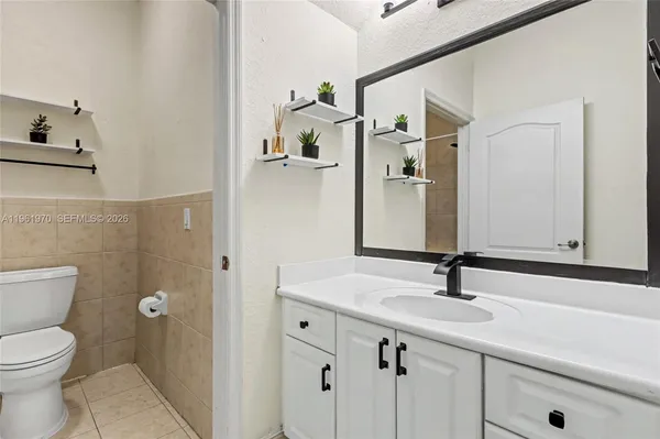 a bathroom with a toilet and bathtub