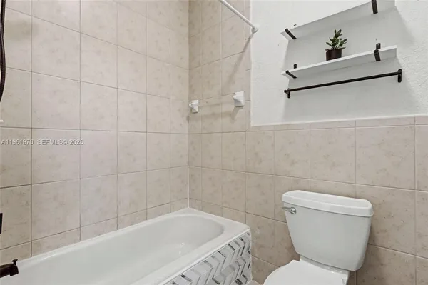 a bathroom with a bath tub